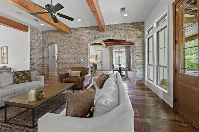 Hand-laid brick archway between the main living spaces