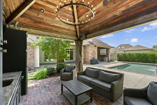 Cabana seating under the vaulted ceiling and iron chandelier