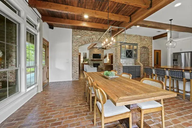 Dining room with iron chandelier, open to the kitchen