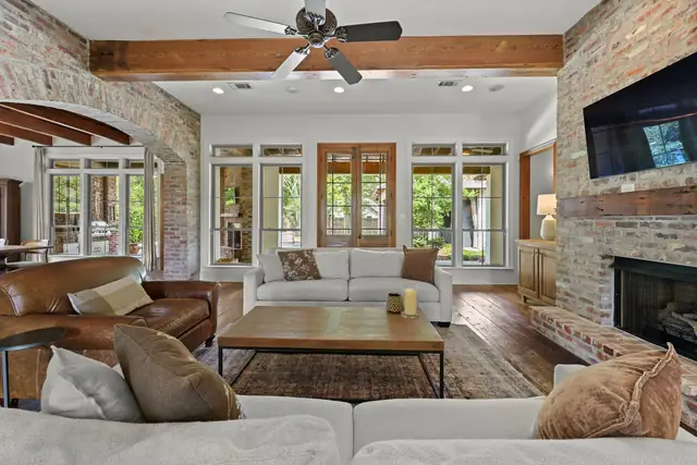 Great room with walls of windows facing the pool