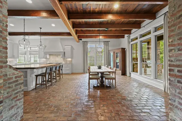 Kitchen bar seating with antique brick floors