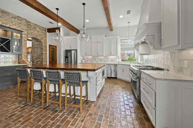 Kitchen with custom wood-block island, open to the dining room