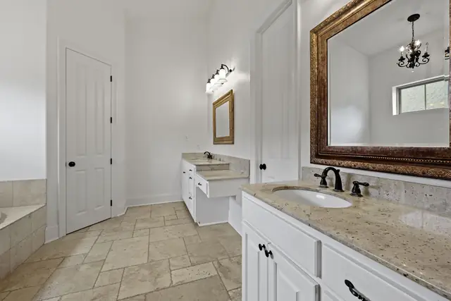 Primary bath vanity with framed mirror